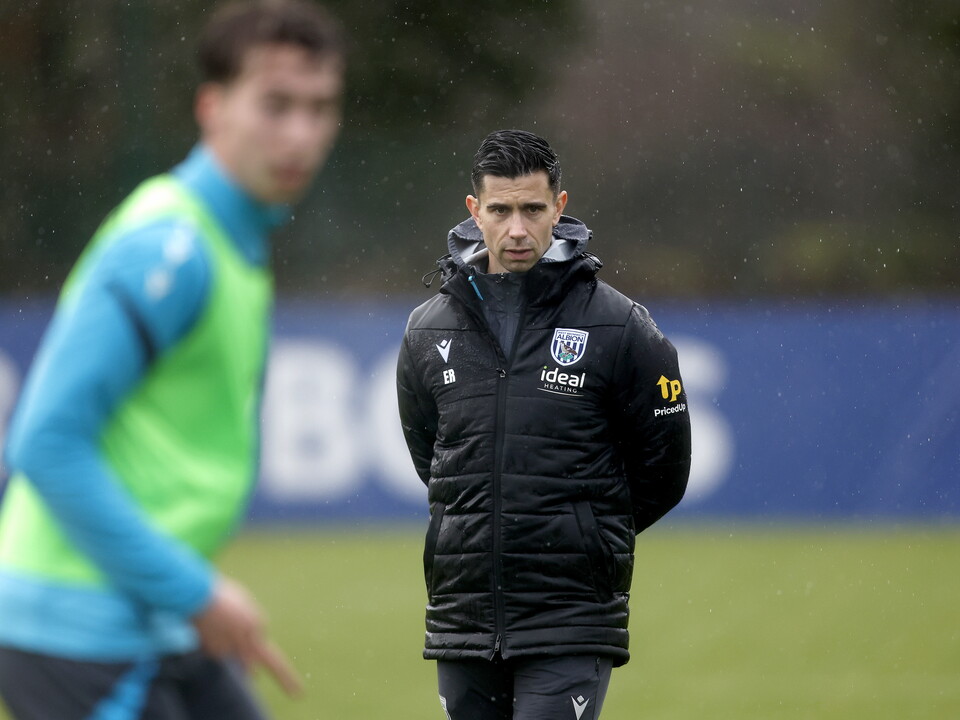 Eric Ramsay watching training in the rain