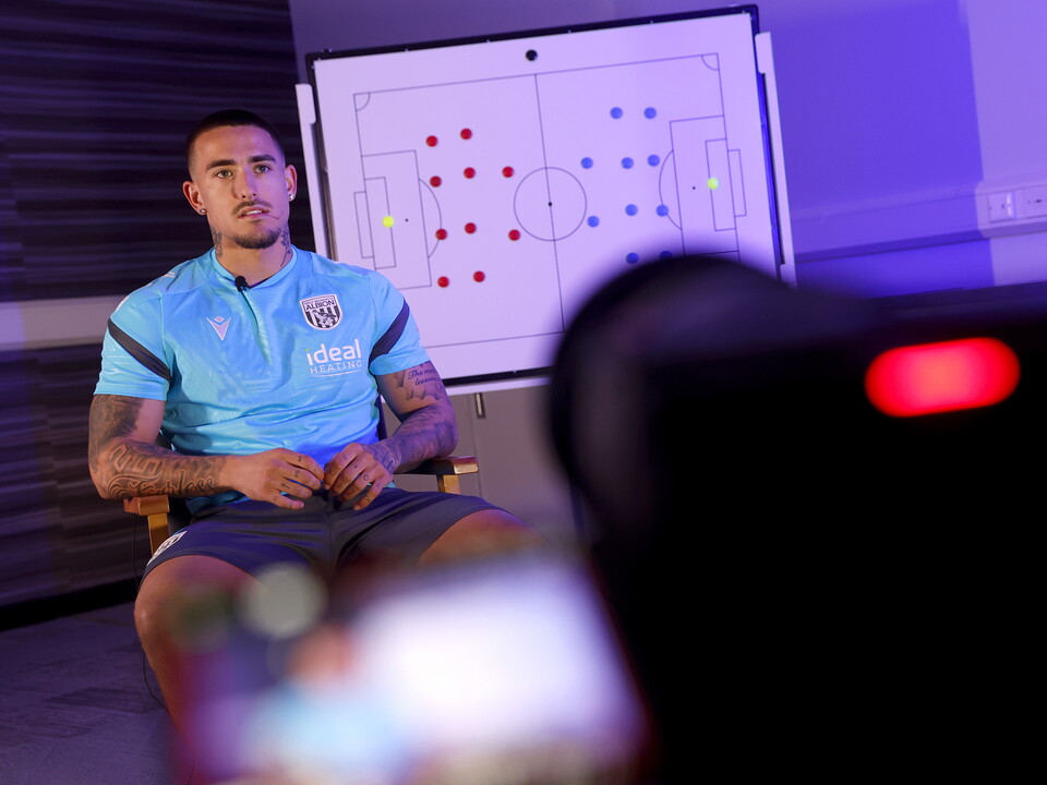 Danny Imray being interviewed by WBA TV while sat in front of a tactics board