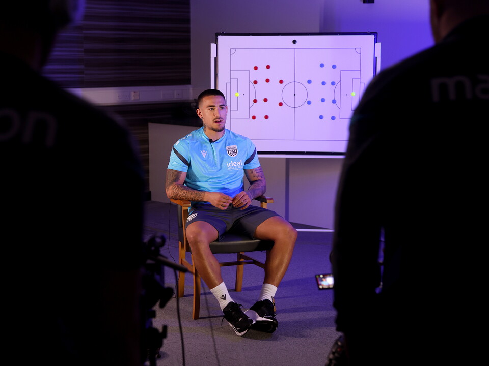 Danny Imray being interviewed by WBA TV while sat in front of a tactics board