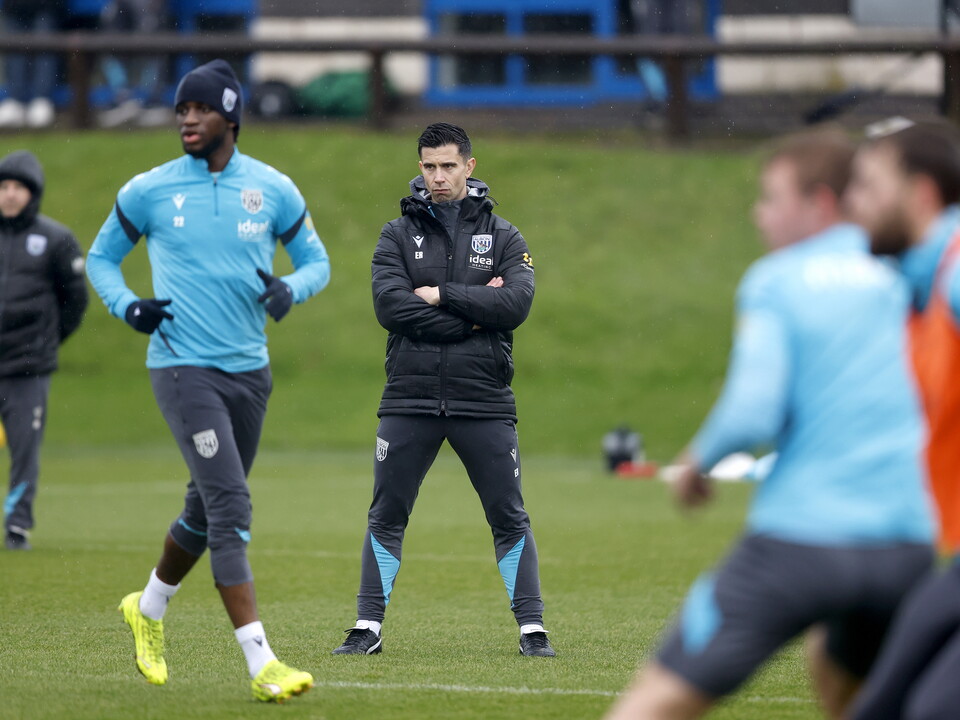 Eric Ramsay watching training in the rain