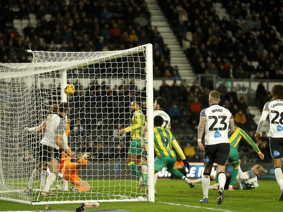 Chris Mepham scoring a header at Derby