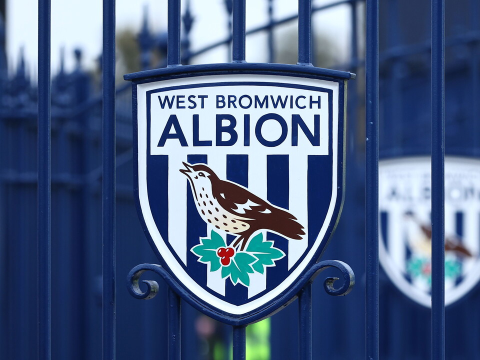 An image of a WBA badge on a gate at The Hawthorns