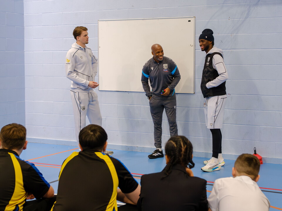 Josh Griffiths and Samuel Lling Junior with Foundation Staff, Jason, standing infront of pupils