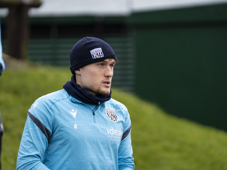 Callum Styles heading out to training wearing a hat