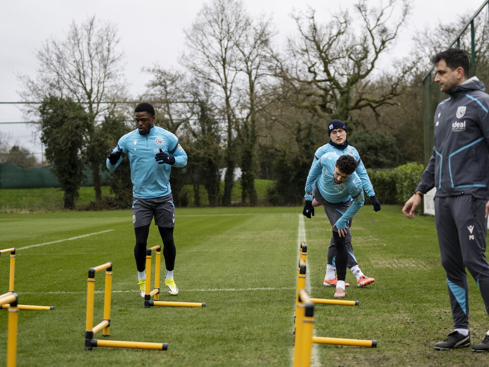 Josh Maja, Callum Styles and Mikey Johnston warming up before a training session