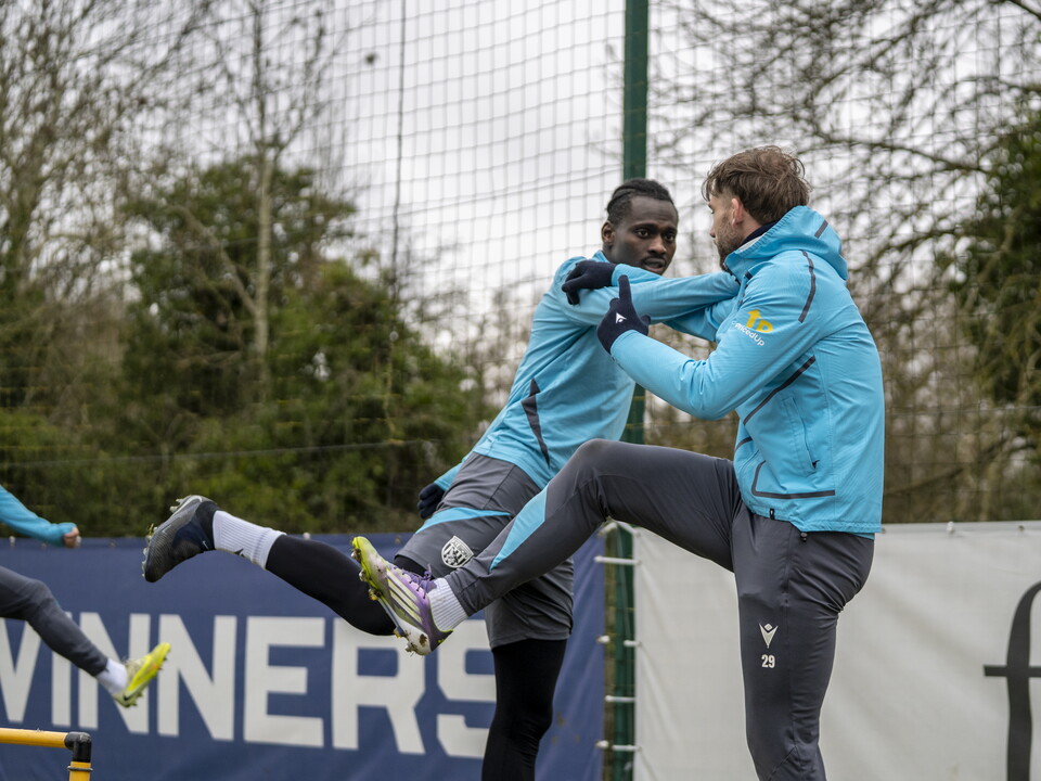 Ousmane Diakité and Charlie Taylor stretching together during training 