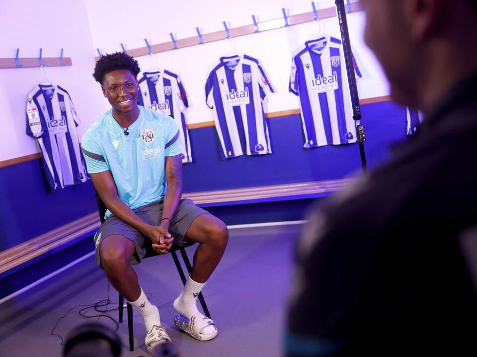 Jamaldeen Jimoh-Aloba being interviewed in a dressing room by WBA TV