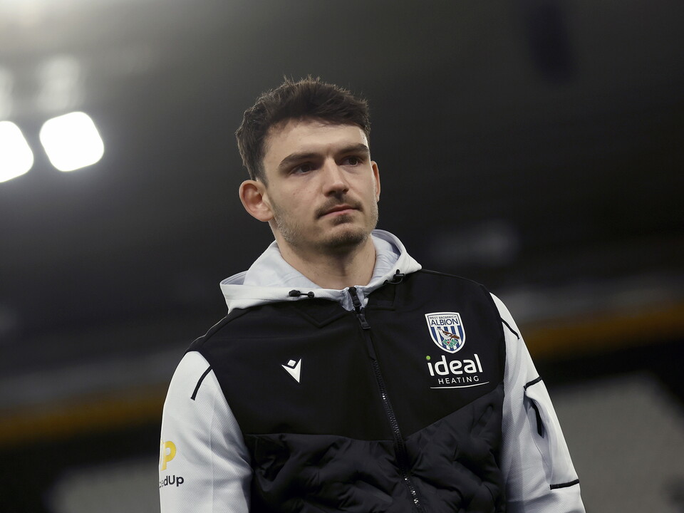 Max O'Leary in a WBA tracksuit at a ground before a game 