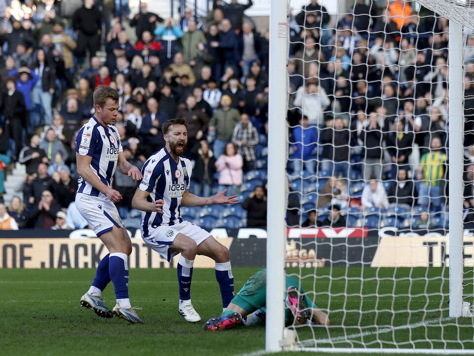 Nat Phillips and Aune Heggebø watch as Hull's goalkeeper Ivor Pandur makes a save