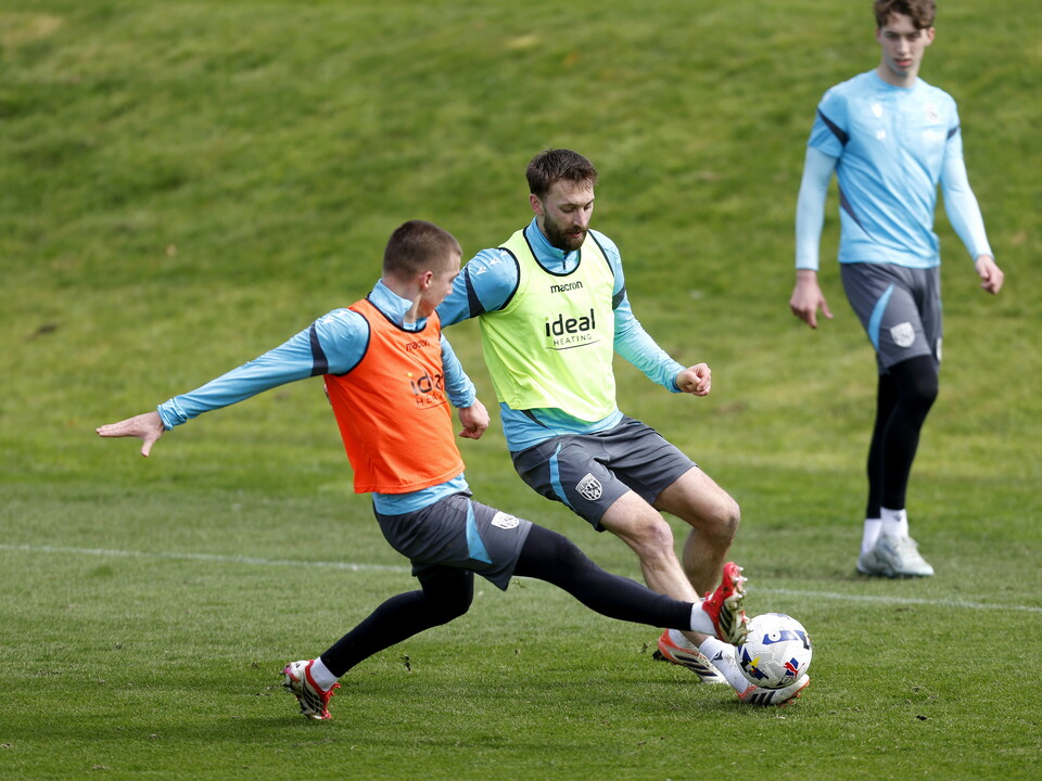 Nat Phillips and Alfie Gilchrist battling for the ball during training 