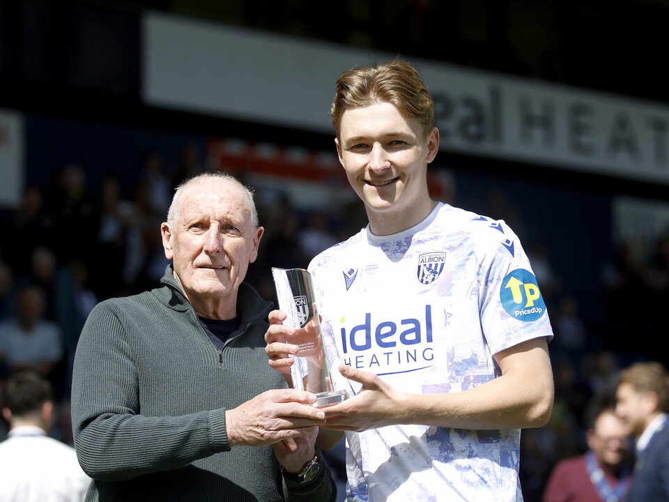 An image of Ollie Bostock with his young player of the season trophy