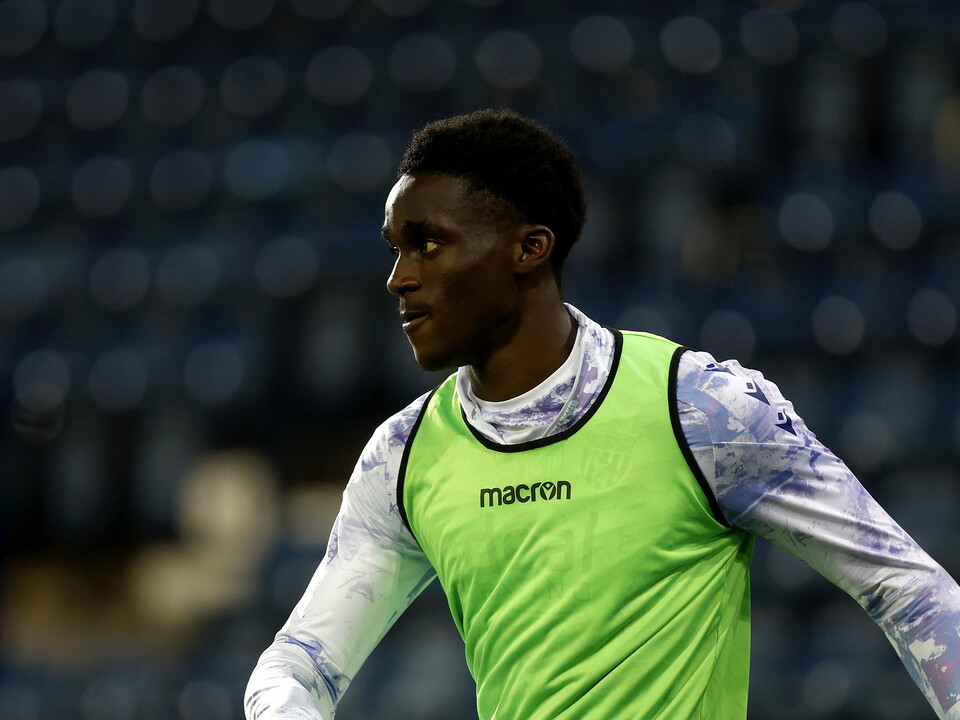 Dan Chimeziri warming up for Albion while wearing a bib 