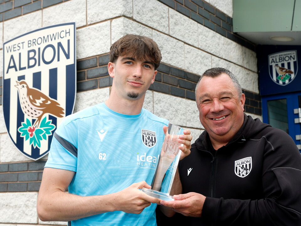 A photo of Alfie Maughan being presented with the 2025/26 Academy Player of the Year award by Academy Manager Richard Stevens