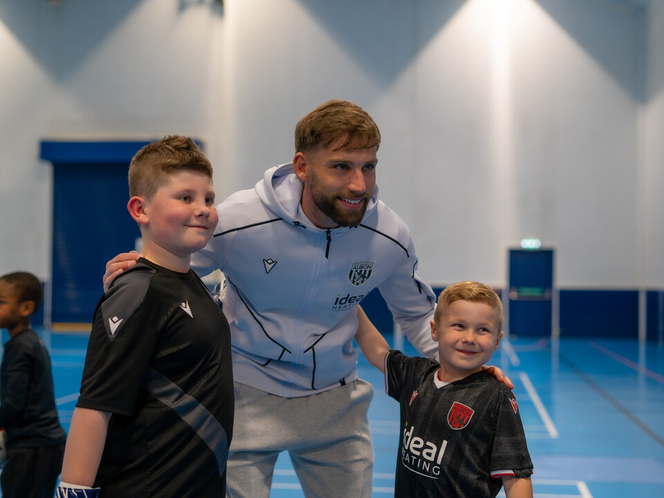 Charlie Taylor taking a photo with fans