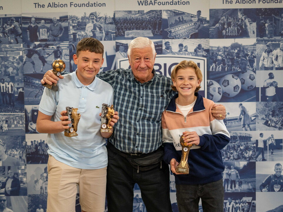 MJPL Players and a parent holding awards.