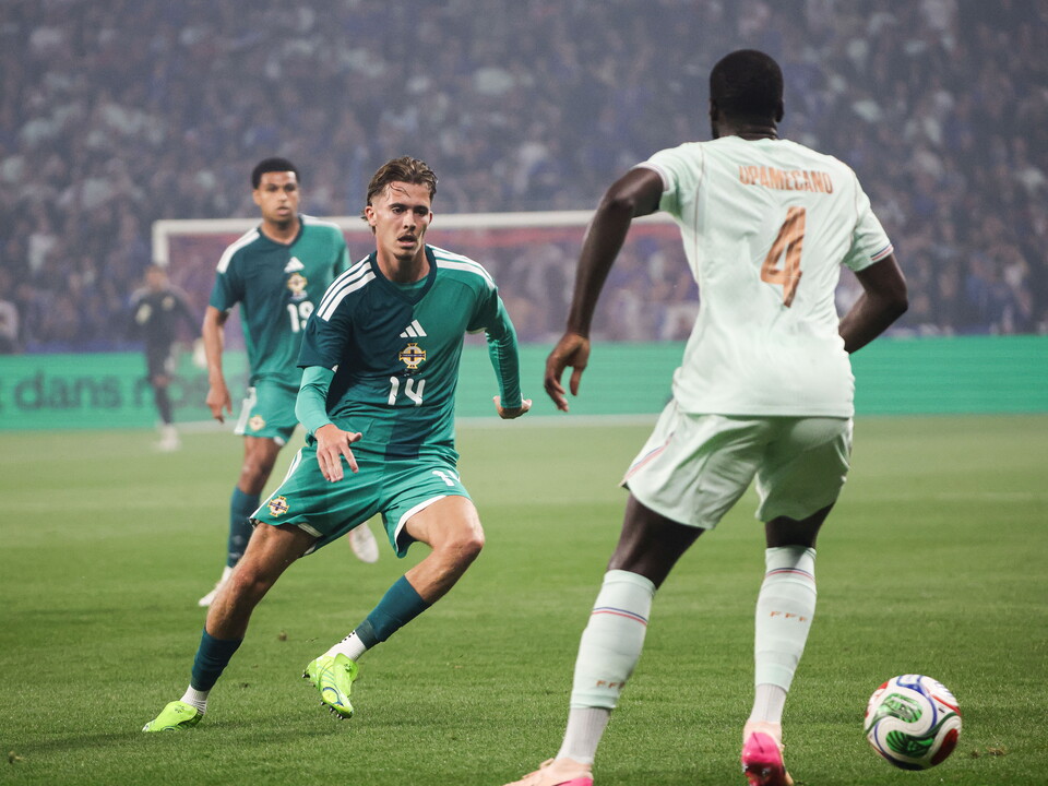 Isaac Price playing for Northern Ireland against France.
