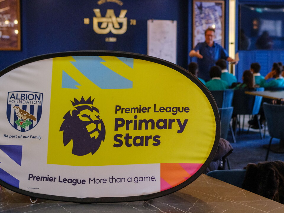 PL Primary Stars banner with a blurred group of children and poet Paul Cookson.