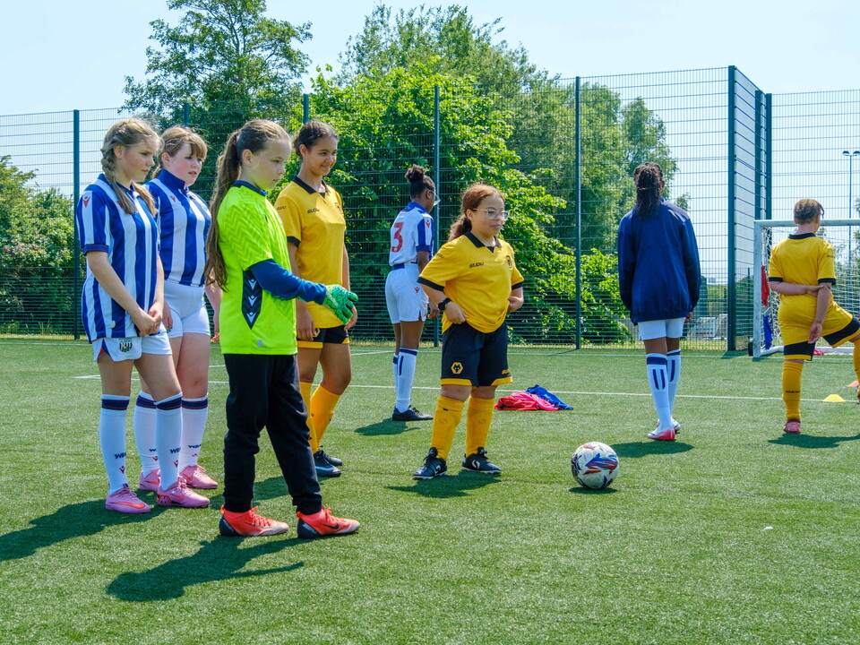 Wolves and Albion girls working together during a target practice drill