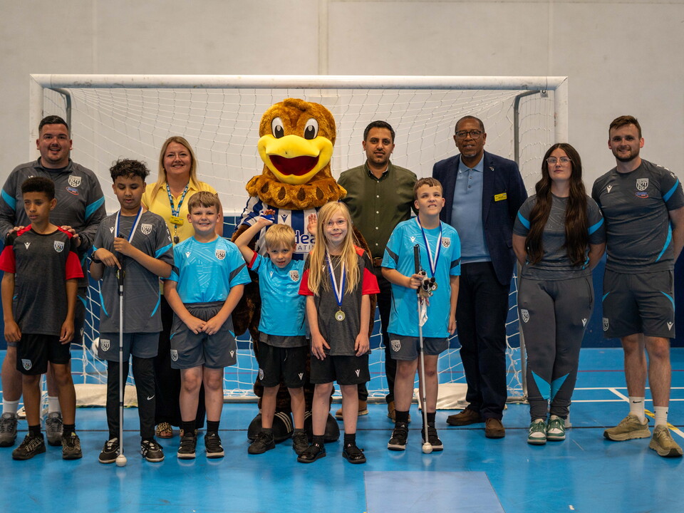 a group photo of our VI Football participants, funders, coaches and baggie bird