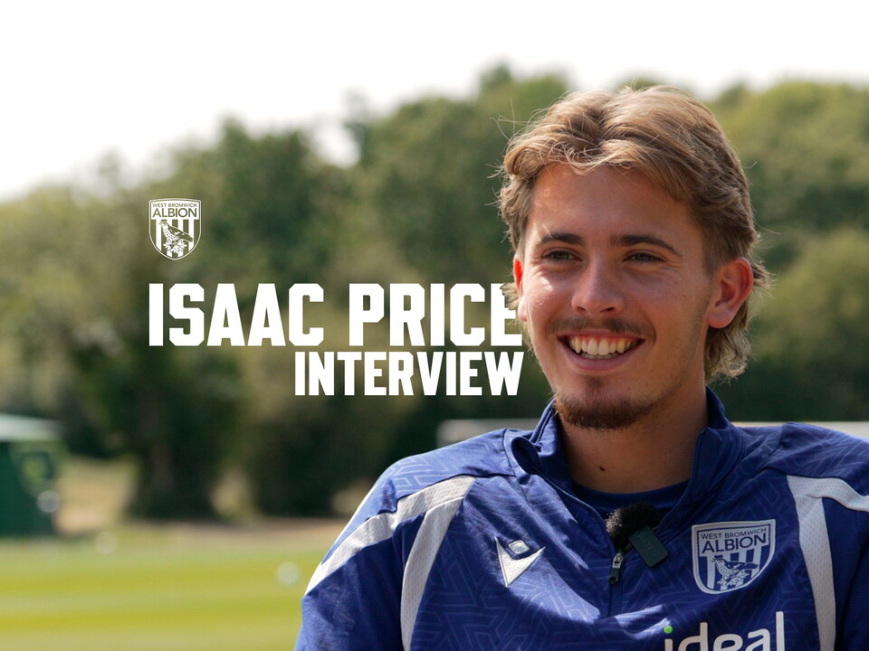 Isaac Price smiling while being interviewed 