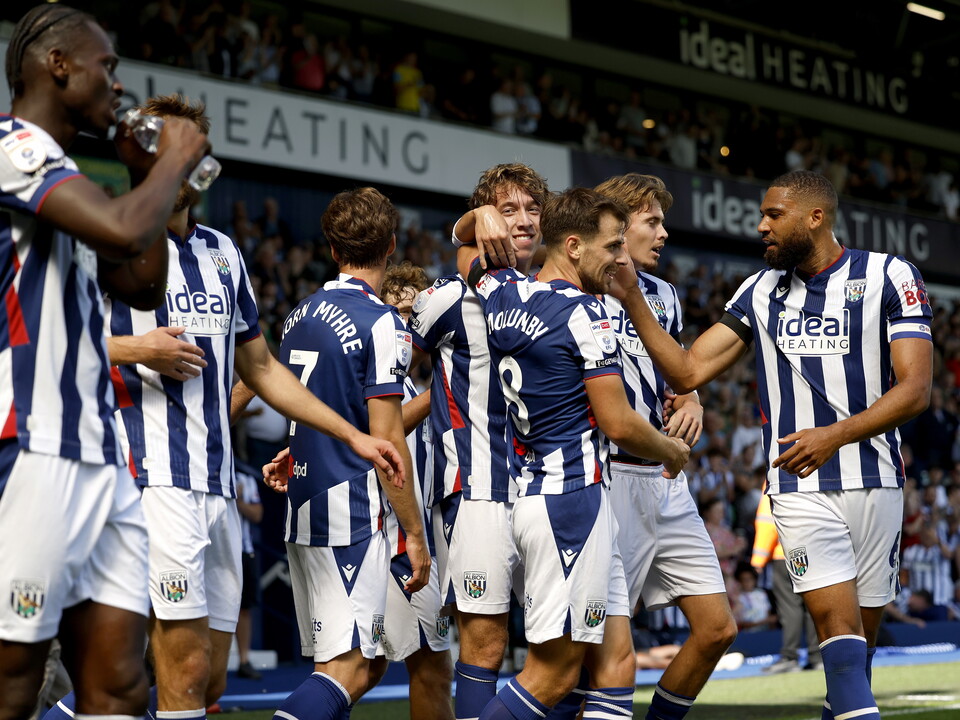 The team celebrate Albion's win over Burnley
