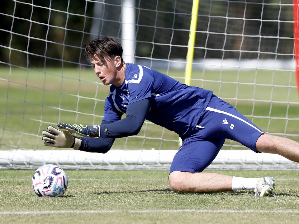 Louis Brady diving to make a save in training 
