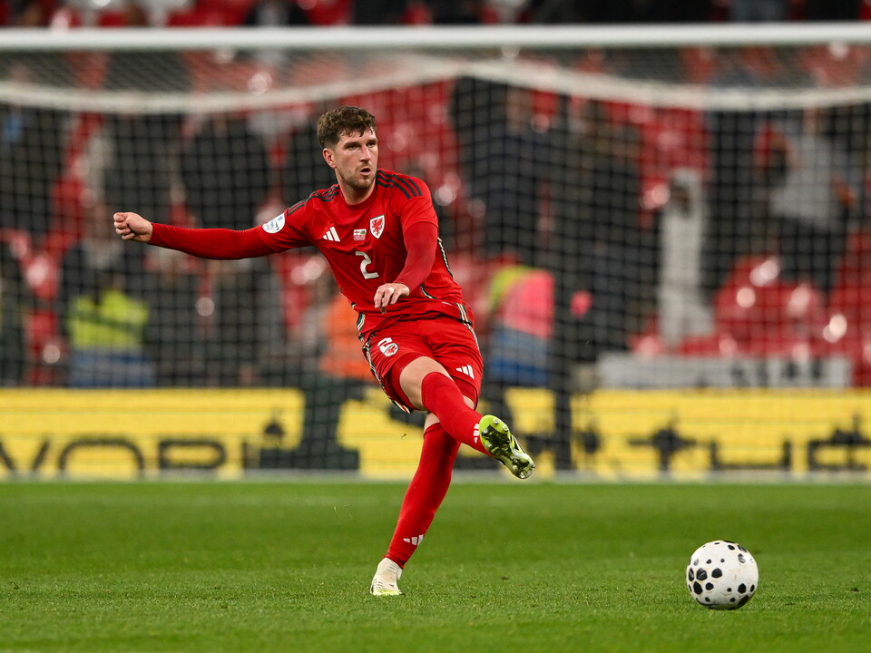 Chris Mepham in action for Wales.