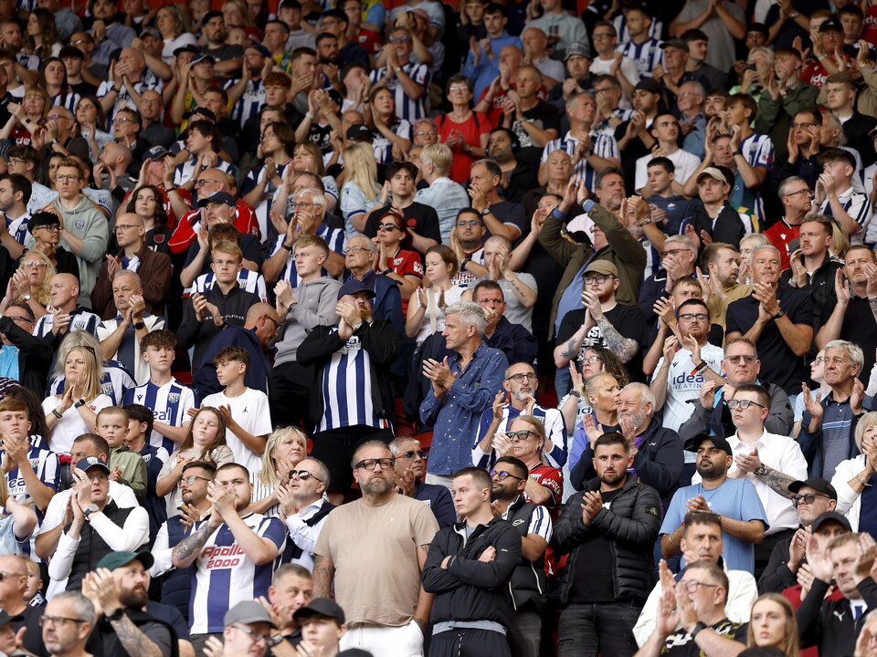 An image of Albion supporters backing their team in an away end