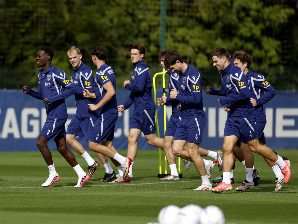 WBA players jogging in a warm up