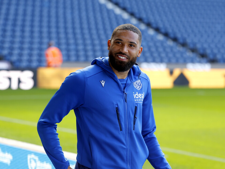 George Campbell smiles on arrival for a matchday