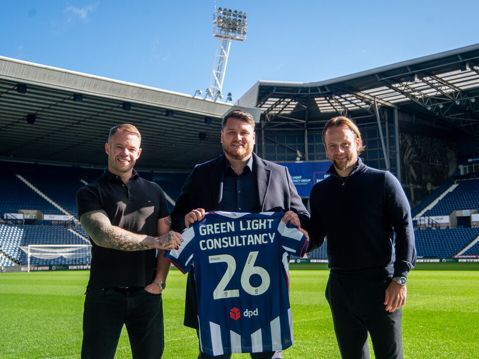Green Light Consultancy presented with Albion shirt. 