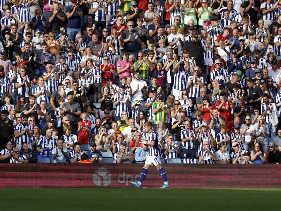 An image of Albion fans applauding JJ Morgan