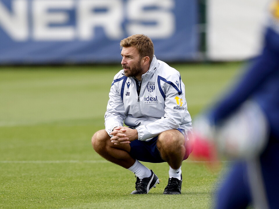 James Morrison crouched down on the training pitch 