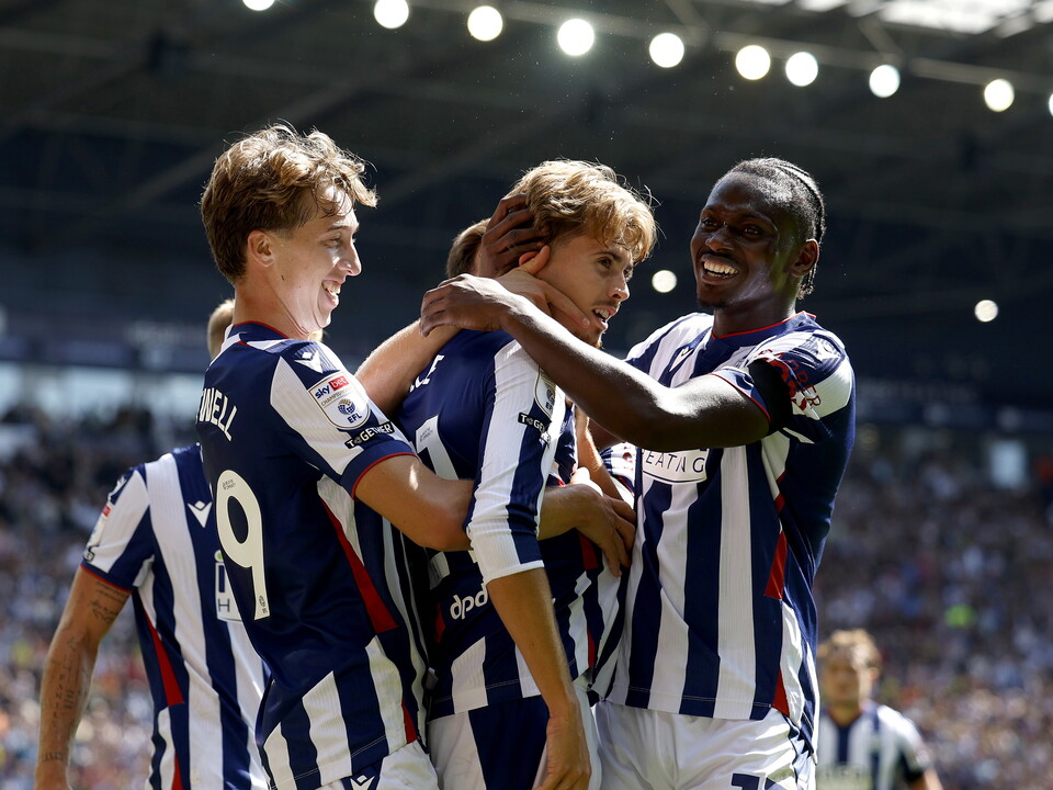 Isaac Price celebrates scoring a goal in the home kit at The Hawthorns with Harry Whitwell and Ousmane Diakité