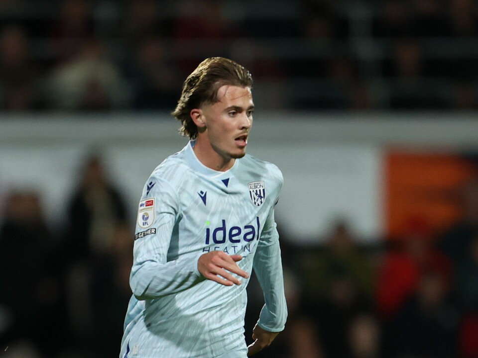 Isaac Price in action in the light blue third kit