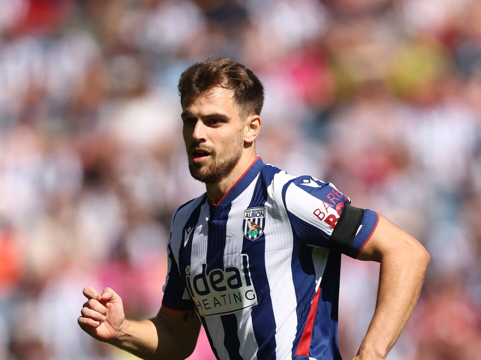 Jayson Molumby in action for Albion in the home kit 