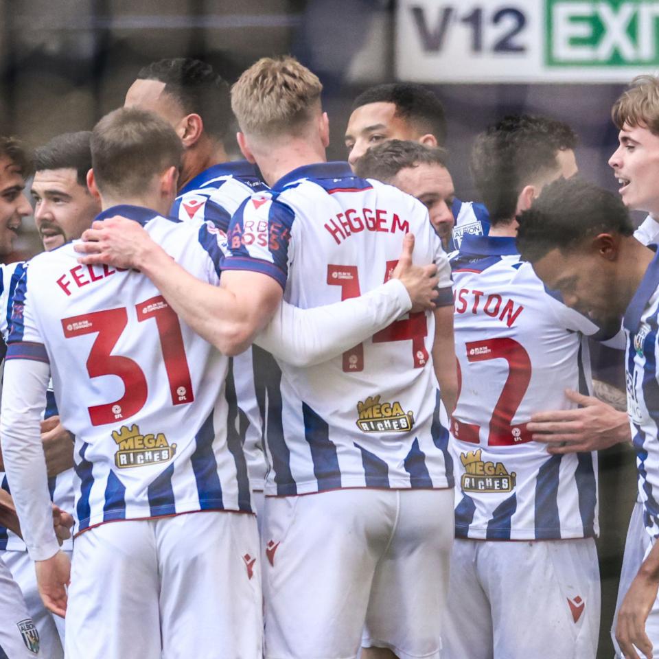 Several Albion players celebrate a goal scored at The Hawthorns in the home kit 