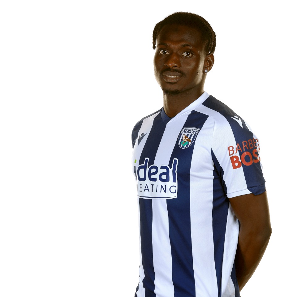 A photo of Albion midfielder Ousmane Diakité in the 2025/26 home kit
