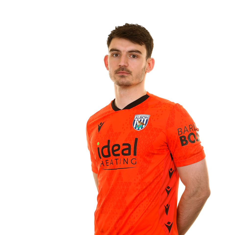 A photo of Albion goalkeeper Max O'Leary in the 2025/26 orange goalkeeper kit