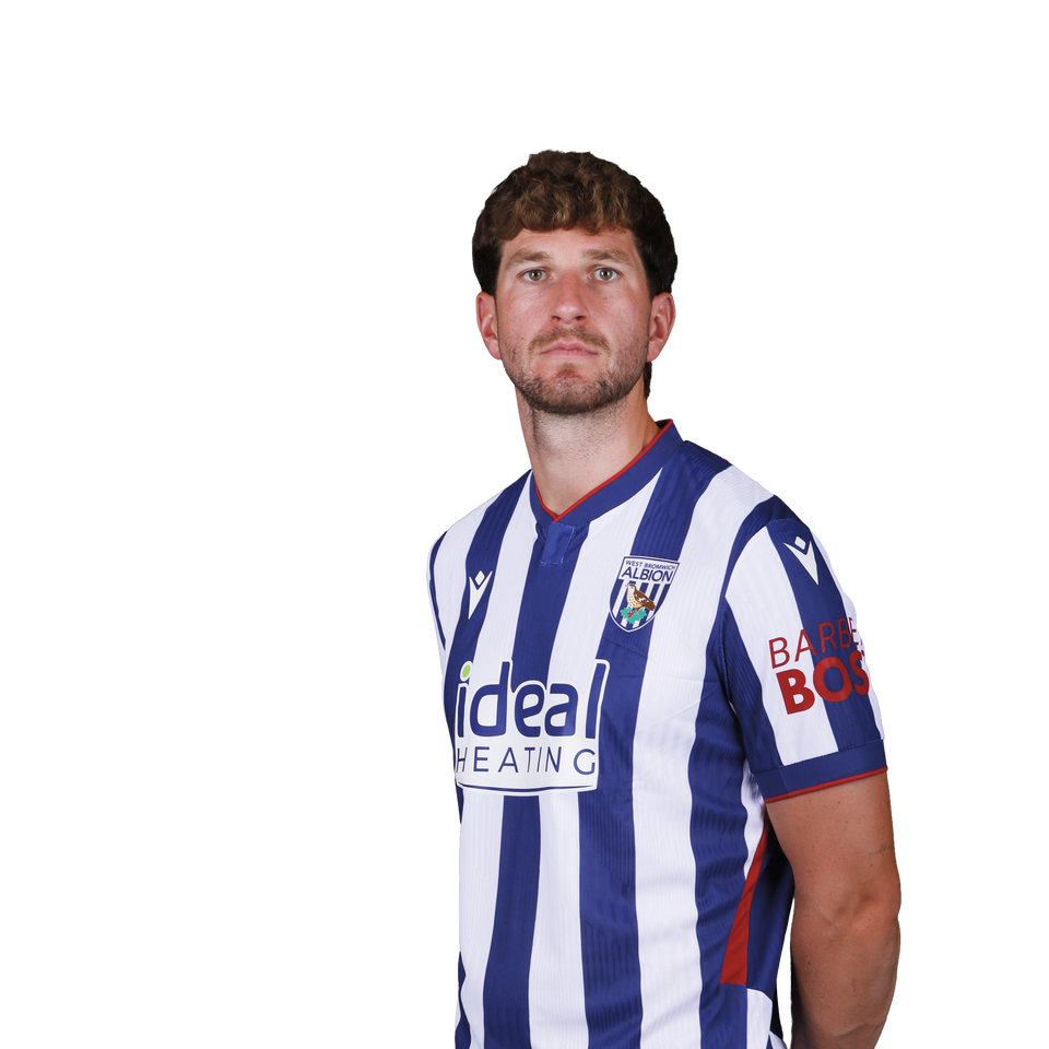 A 2026/27 headshot of Chris Mepham in the home kit